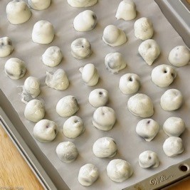 Frozen yogurt covered blueberries.